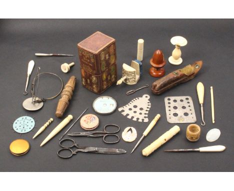 A mixed lot _ sewing _ including knitting needle gauges, a Chinese carved ivory clamp, a wooden acorn form thimble case, a ïW