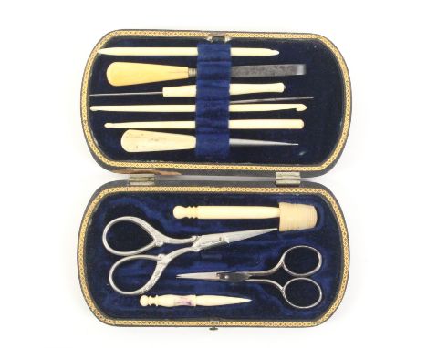 A Tartan Ware sewing companion (MÍLean) of curved end rectangular form, blue velvet interior with a selection of bone and oth