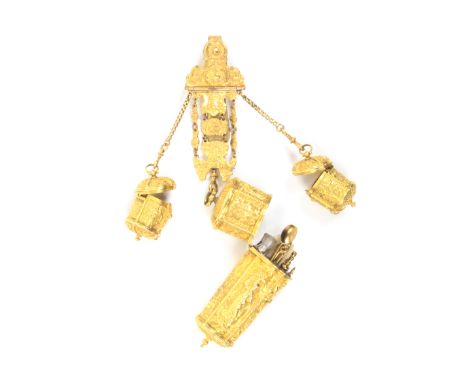 A fine late 18th Century gilded chatelaine etui, the shell and scroll mount with two outer chains to a pair of hinged cover b