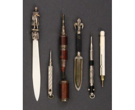 Four pencils and two other pieces, all with Stanhopes comprising a bone handled pencil (landscape image, untitled, distorted)