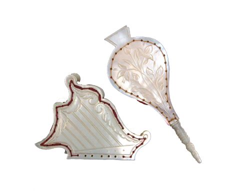 Two cut out and engraved mother of pearl pincushions comprising one in the form of a harp, 5cm high, the other as a set of be
