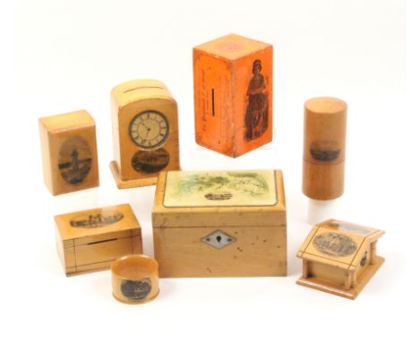 Mauchline ware _ eight pieces comprising a clock form money box (Newbiggin Beach), 11cm, a collecting box orange ground (Soci