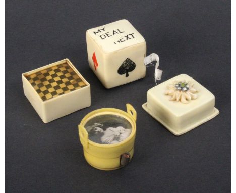 Four novelty celluloid tape measures comprising a chess/morris board, 3.2cm, a pail with photograph of a young girl inset to 