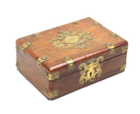 A late 19th Century rosewood and brass mounted rectangular box, brass escutcheon and lid panel within brass straps, the inter