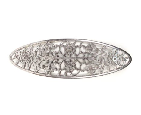 An exceptional large 18th Century polished steel shuttle, Ex. collection of Sylvia Groves, each side with a mirror design of 