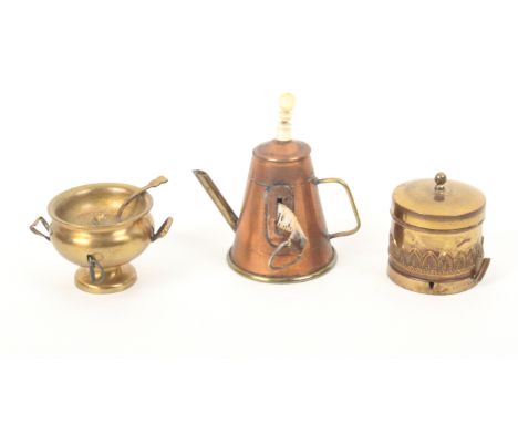 Three metal novelty tape measures comprising a brass soup tureen with ladle, 5.5cm, a lidded cylinder coal bin, with thimble 