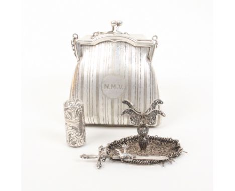 A mixed lot comprising a miniature silver filigree table, probably Chinese, 5.7cm wide, an unmarked silver pin cylinder, 3.5c