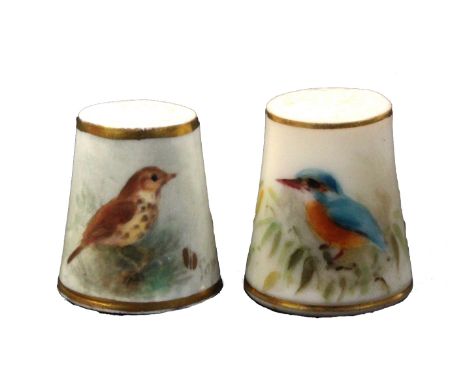 Two Royal Worcester porcelain thimbles, comprising a puce mark example painted with a kingfisher, signed Powell, within gilt 