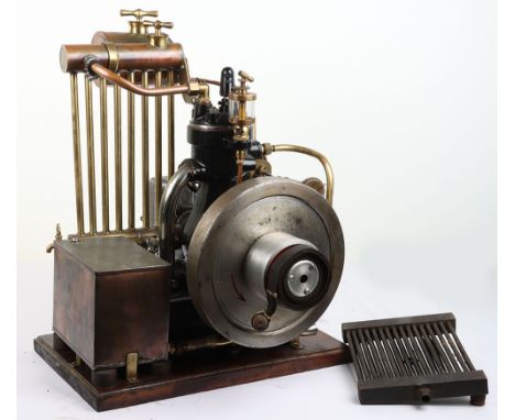 A large vertical engine with dynamo, radiator and water tank, cast engine with spark plug, pressure gauge, 10” (25.5cm) solid