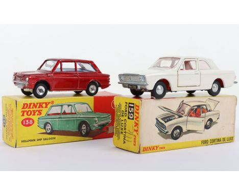 Two Boxed Dinky Toys Ford Cars, 138 Hillman Imp Saloon, metallic red body, blue interior, with suitcase and 159 Ford Cortina 