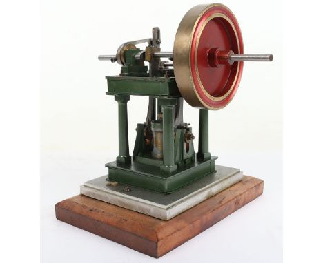 A single cylinder vertical steam engine, ½” bore x ¾” stroke brass cylinder, cast guides, valve chest, four pillar frame with