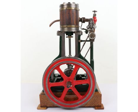 A good Nasmyth-framed single cylinder inverted vertical engine, with mahogany clad rounded 1 1/” bore x 2 ½” stroke single cy