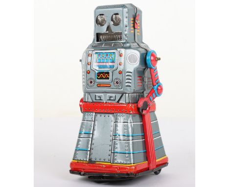 KO (Japan) tinplate friction driven skirted Atom Robot, 1950s, lithographed tinplate Robot with crank wound friction bump and