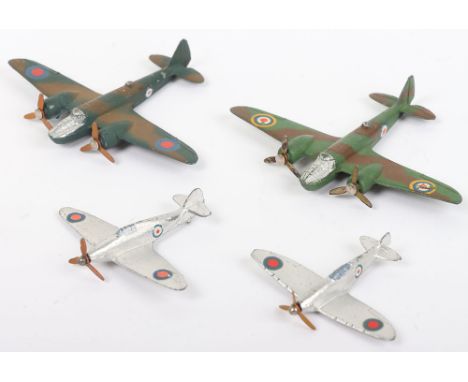 Four Dinky Toys Aircraft, 62a Spitfire, silver body, 2 x 62d Bristol Blenheim Bombers (camouflaged) 62s Hawker Hurricane, sil