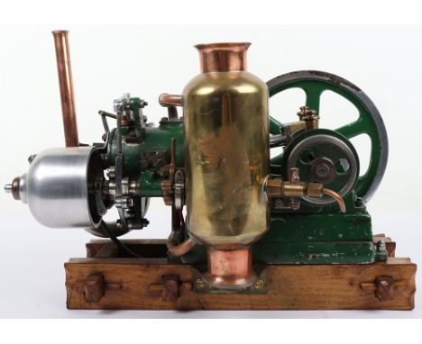 An interesting cast iron horizontal single cylinder petrol engine, 1 ½” bore x 3”stroke cylinder, piston with brass weights a