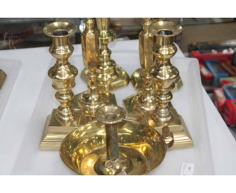 THREE PAIRS OF BRASS CANDLESTICKS
together with a chamber candlestick 