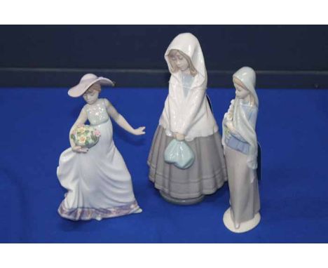 TWO LLADRO FIGURINES AND A NAO FIGURINE
including 'Carefree', 5790, with original box (3)