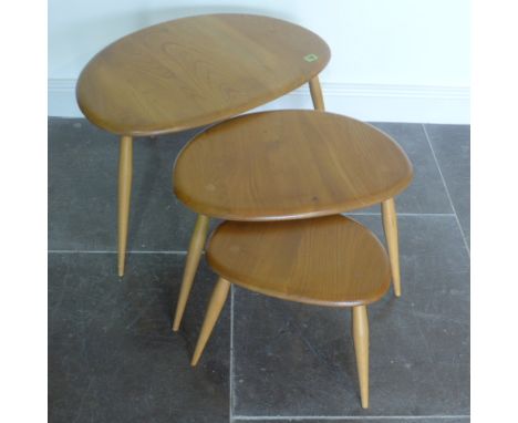 An Ercol Golden Dawn nest of three Pebble side tables - Height 40cm x 65cm x 44cm - good condition, some small marks to top o