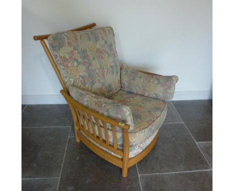 An Ercol Golden Dawn upholstered elm slatted armchair in good condition - Height 96cm x Width 84cm 