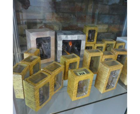 A collection of 30 New Line boxed Lord of the Rings lead painted figures with three stands 