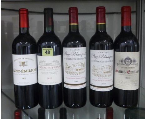 Six bottles of Saint Emilion red wine Chateau de Ferrand 2012 x 2, Puy-Blanquet x 2, Christian Moueix 2001 and Grand Vin Bord