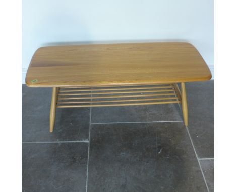 An Ercol Golden Dawn blonde elm coffee table with under tier - Height 37cm x 104cm x 46cm - minor usage marks, good condition