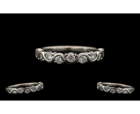 A Modern Contemporary Designed 18ct White Gold Diamond Set Half-Eternity Ring.  Marked 750 - 18 ct.  Diamonds of excellent co