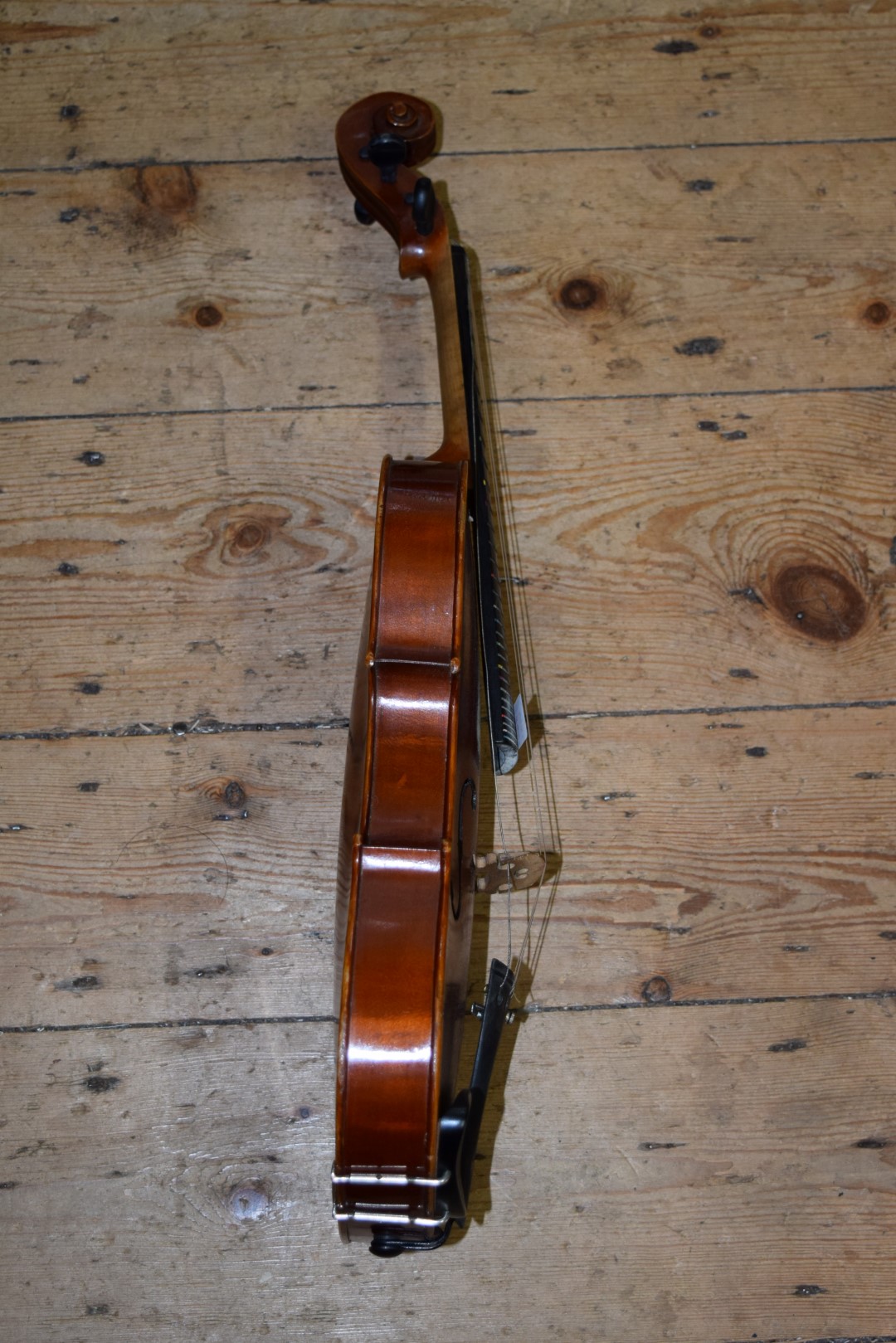 An old violin, with 14in back, labelled 'The London Manby Violin Co Ltd