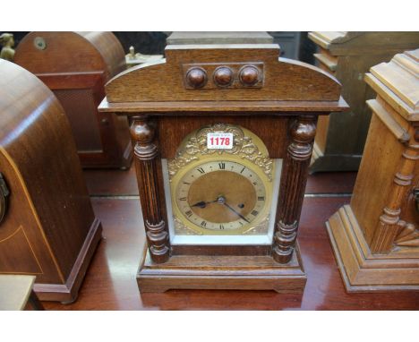 An old oak mantel clock, 37.5cm high.