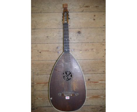 A German guitar lute, circa 1900, stamped 'Oest M. Sch. 2710', with scalloped fretboard.