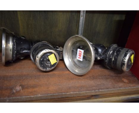 Two vintage Lucas car lamps; together with a copy of 'The Manual of Driving and Maintenance for Mechanical Vehicles (wheeled)