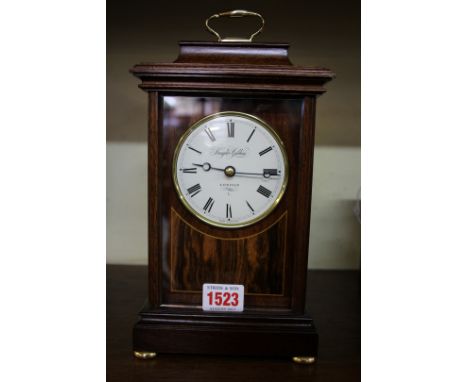 A good reproduction mahogany mantel clock, the circular enamel dial inscribed 'Knight Gibbins, London', 27cm high. 