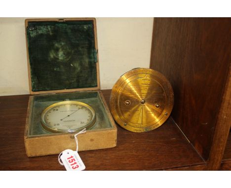 A Negretti & Zambra gilt brass forecasting aneroid barometer, No. 8870, boxed with two further related dial gauges.    Condit