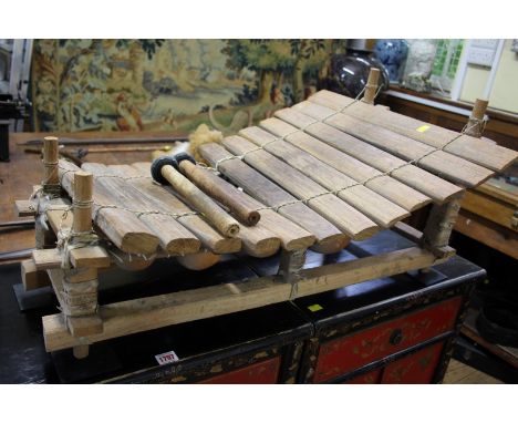 Ethnographica: a West African Marumba, 89cm wide, with two mallets. 