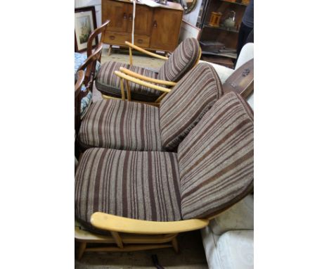 An Ercol pale wood settee and matching armchair. 