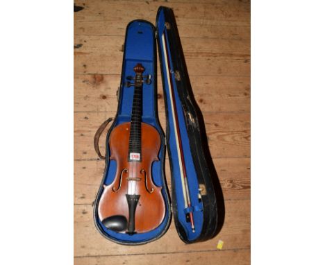 An old violin, with 14in back, labelled 'The London Manby Violin Co Ltd, exact copy of Old Master...', in case and with two b