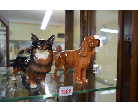 Two Beswick dogs, comprising Corgi and Light Brown Spaniel. 