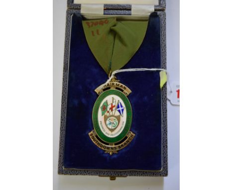 A silver gilt and enamel National Association of Licensed House Managers, Chairman Southdowns Branch neck badge, boxed. 