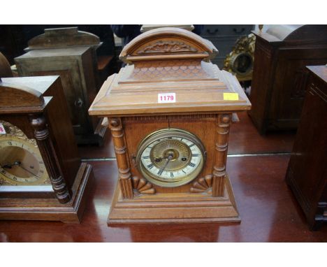 An old oak mantel clock, 42cm high.