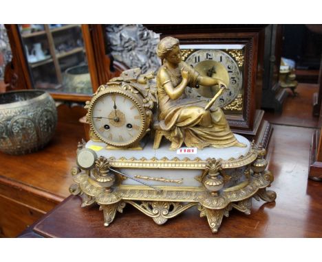 A late 19th century gilt metal and alabaster mantel clock, 38cm wide. 