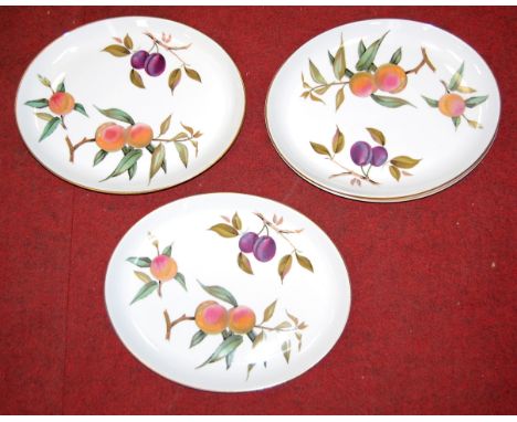 A set of eight Royal Worcester plates of oval form in the Evesham pattern