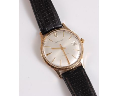 A gentleman's 18ct gold Automatic wristwatch by Garrard, the signed round dial with gold baton numerals and hands, black minu