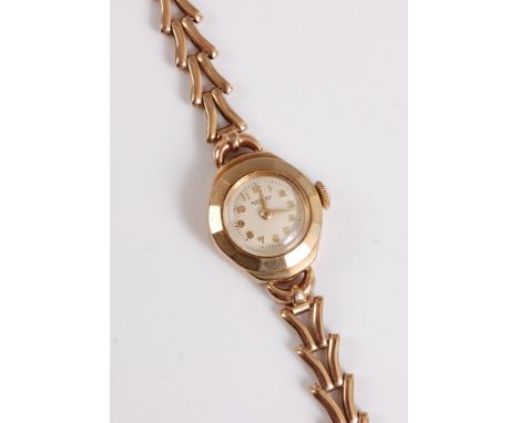 A lady's 9ct Rotary wristwatch, the signed round dial with Arabic numerals, gold case stamped 375, 17mm diameter, with gold b
