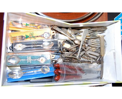 A box of miscellaneous items, to include loose silver plated flatware, souvenir spoons etc
