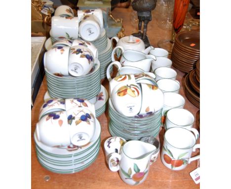 A Royal Worcester 12 place setting tea and dinner service in the Evesham Vale pattern. Light wear throughout, consistent with