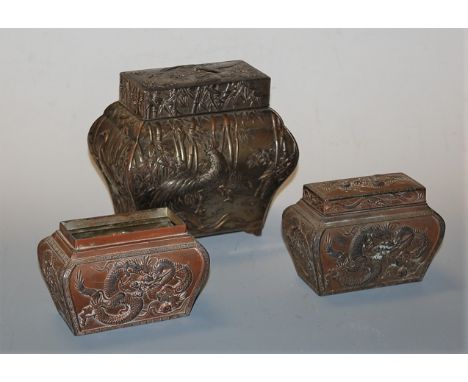 An early 20th century Chinese silver plate on copper tea caddy, of bombe form, relief decorated with a bird amongst bamboo, h