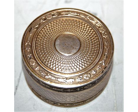 A 19th century engine turned silver pill-box, of cylindrical form, having gilt-washed interior, dia. 3.5cm
