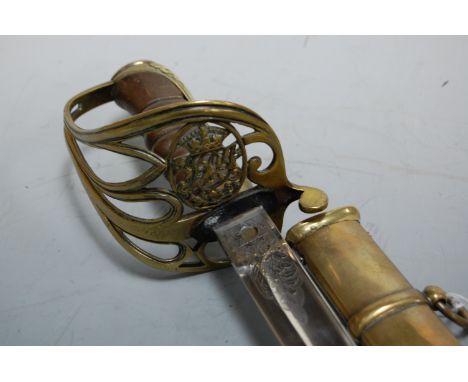 An 1854 pattern Officers sword, having an 84cm straight fullered blade, etched with crowned VR cipher amongst foliage, having