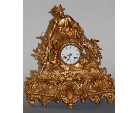 A late 19th century gilt metal cased mantel clock having a convex enamel dial with Roman numerals and eight day movement, the