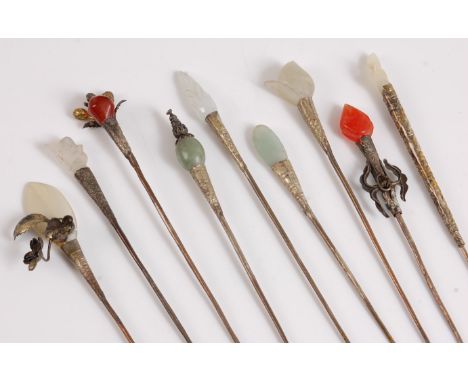 Ten hat/hair pins with agate and jade tops and Eastern white metal style decoration, approx. 16cm long, together with a medie